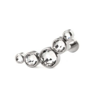 Labret af titanium med push-in top i forskellige farver indfattet sten