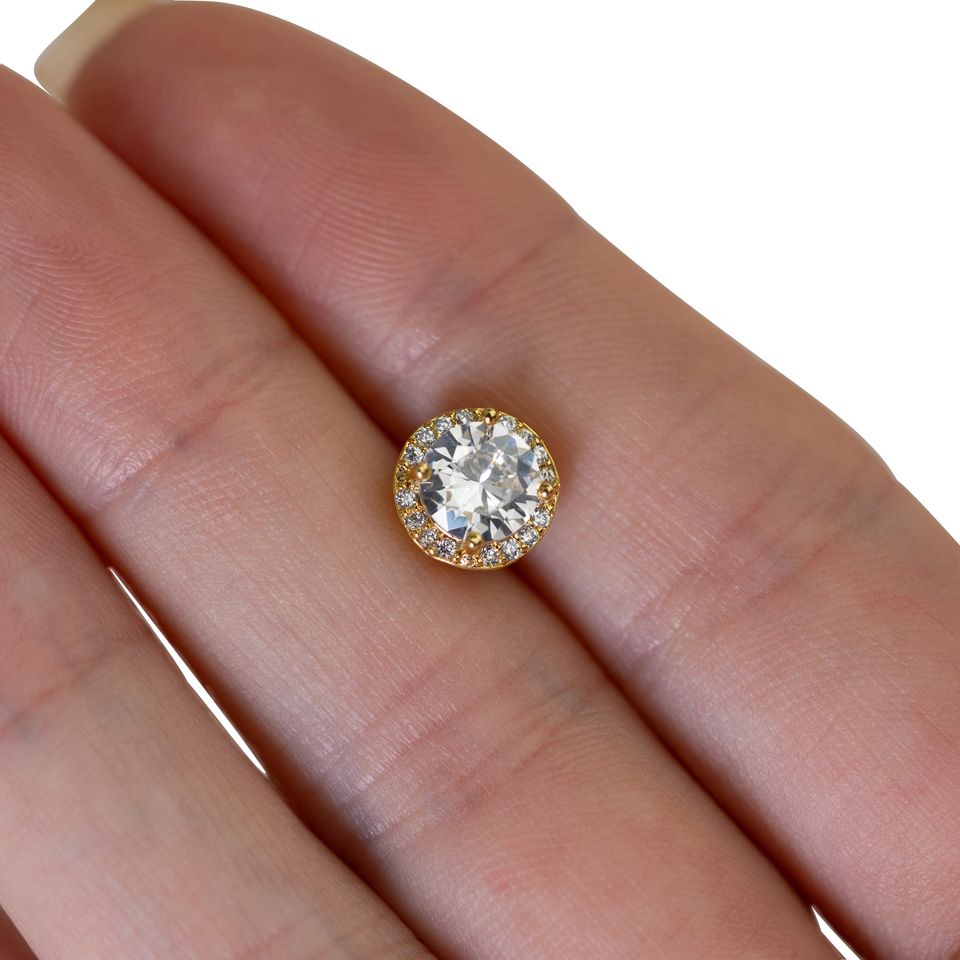 Rund dermal med facetskåret centersten i flere farver