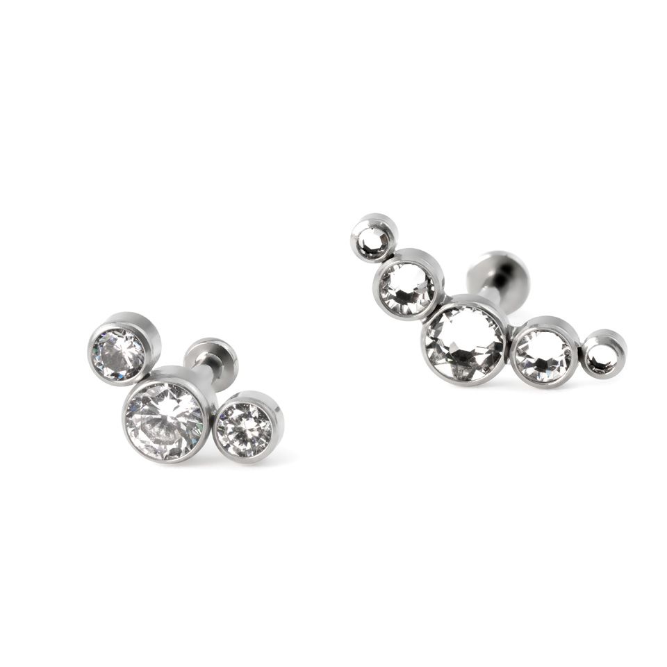 Labret af titanium med push-in top i forskellige farver indfattet sten
