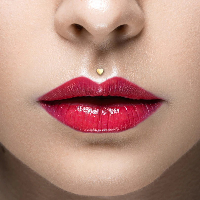 Labret af 14 karat guld med hjertetop