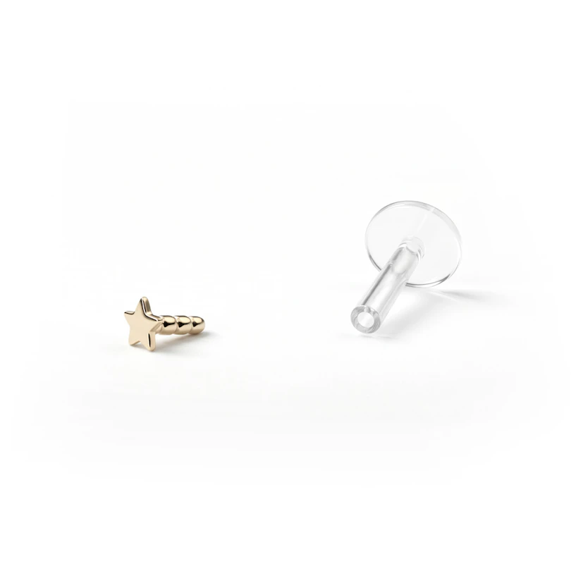 Labret af 14 karat guld med stjernetop