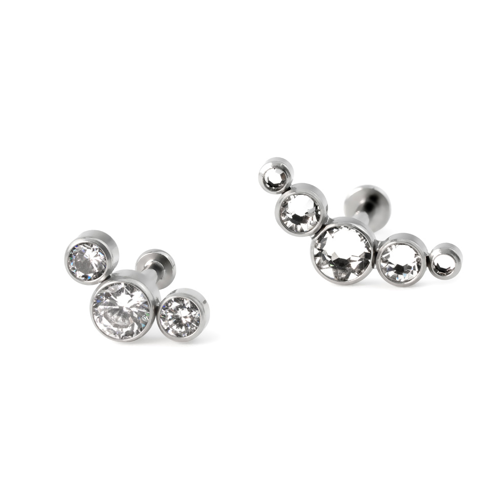 Labret af titanium med push-in top i forskellige farver indfattet sten