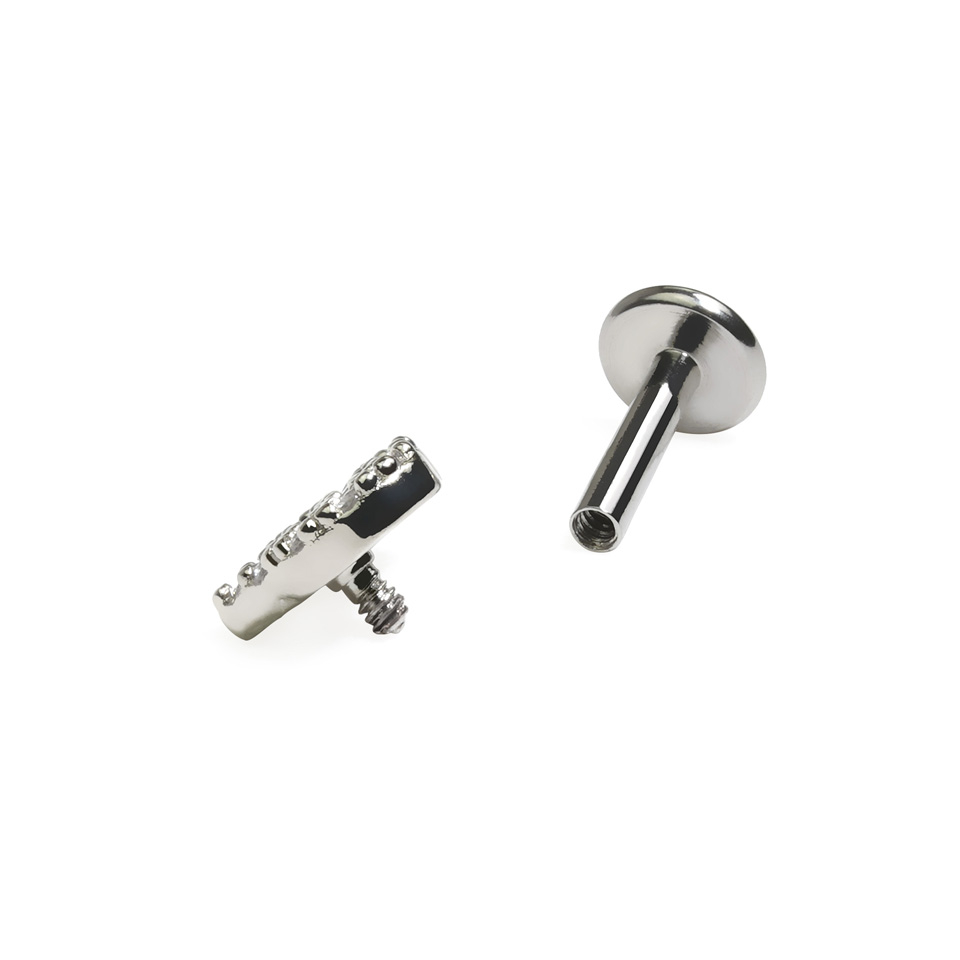 Labret med indvendigt gevind og stenbesat hjertetop.