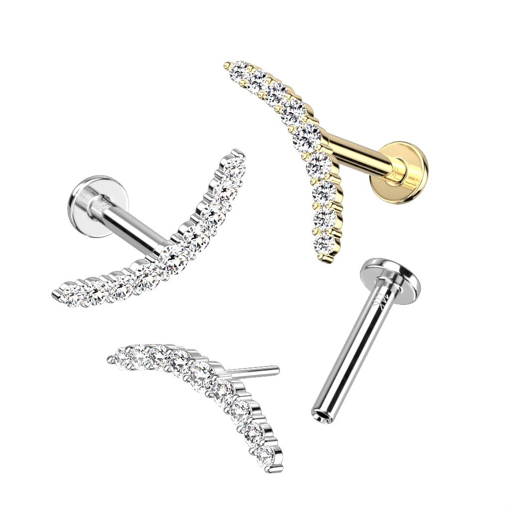 Push-in labret af 14 karat guld med 9 sten i blød bue